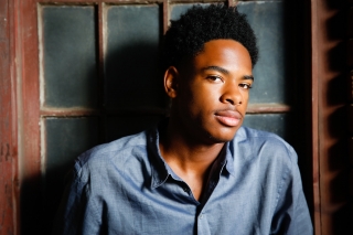 African American College hopeful combines his love for basketball and his excellent sense of style in his high school senior pictures.