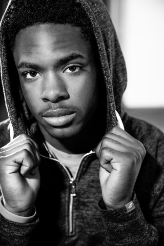 African American College hopeful combines his love for basketball and his excellent sense of style in his high school senior pictures.