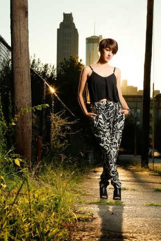 Edgy Senior female with short hair in Georgia with the skyline.